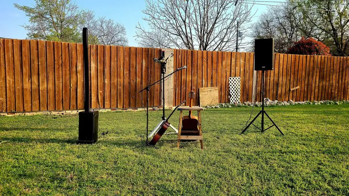 DJ Smokey Dave speaker setup at an outdoor backyard event