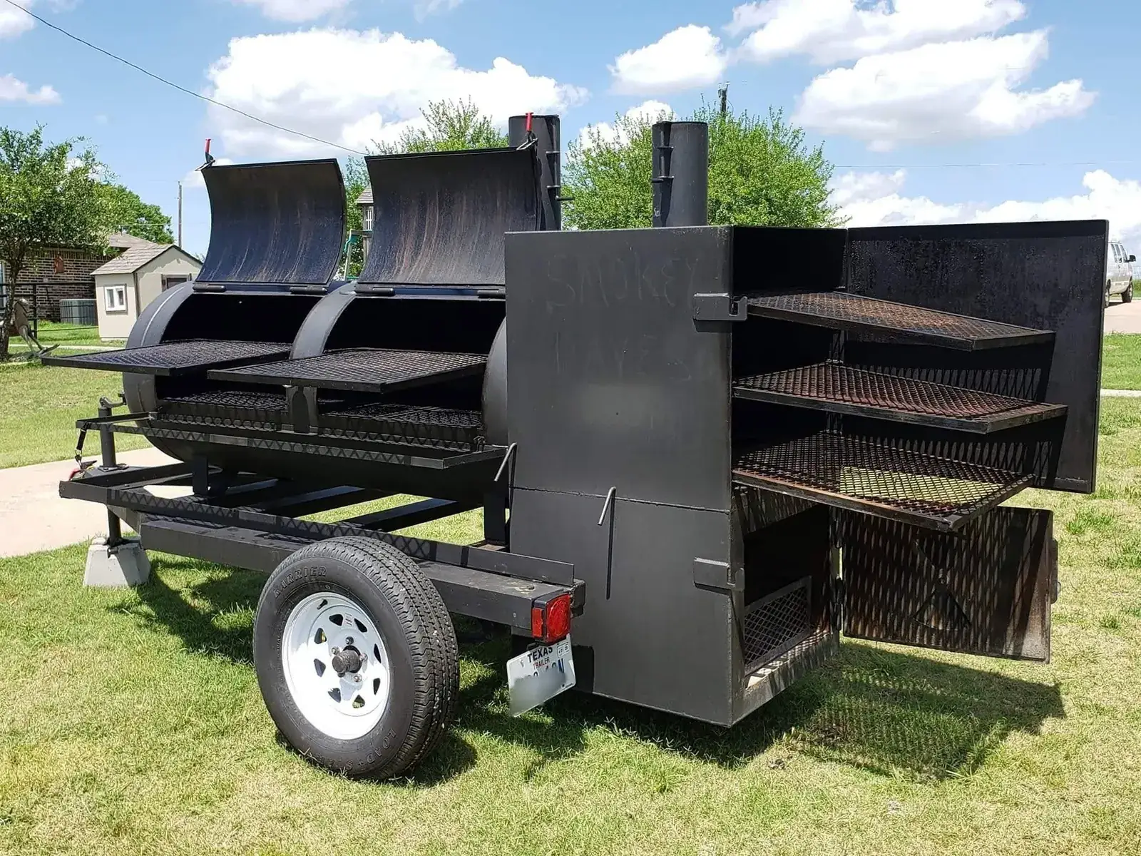 Trinity, Smokey Dave's custom reverse-flow smoker trailer, with lids open