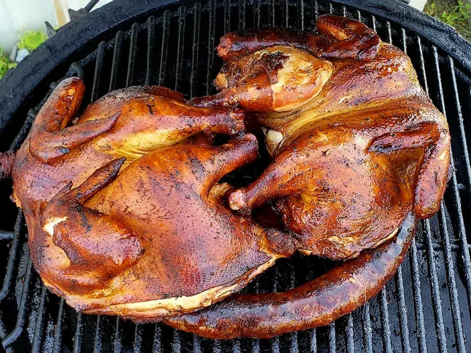 Smoked chickens with a deep mahogany bark